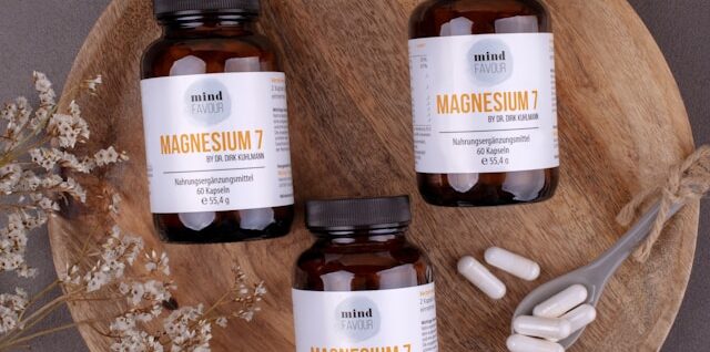 three bottles of magnesum on a wooden plate
